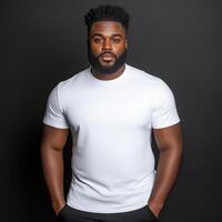 Confident pose of a man wearing a simple white t-shirt in studio setting photo