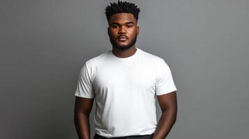 Young man posing confidently in a stylish white shirt against a gray backdrop photo