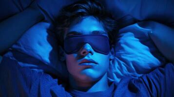 Relaxation during nighttime with sleep mask in a blue-lit room setting photo