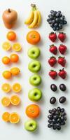 Colorful arrangement of fresh fruits on a white background for healthy eating photo