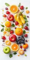Fresh fruit arrangement with vibrant colors and variety on a white background photo