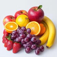 Vibrant collection of fresh fruits arranged on a light background photo