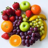 Colorful assortment of fresh fruits arranged on a white surface photo