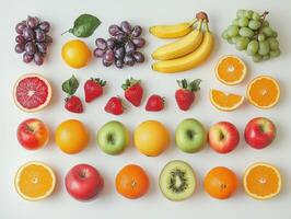 Colorful arrangement of fresh fruits on a white background photo