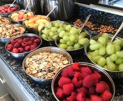 Fruit and nut selection at a healthy breakfast bar with various options photo