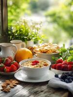 Breakfast spread with fresh fruits and oats in a sunny kitchen photo