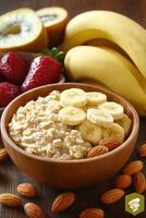 Healthy oatmeal bowl with banana, strawberries, kiwi, and almonds photo