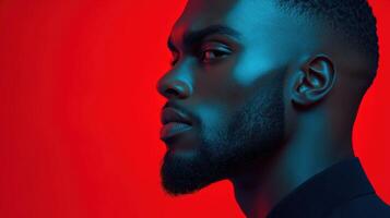 Portrait of a man with defined features and vibrant lighting backdrop photo