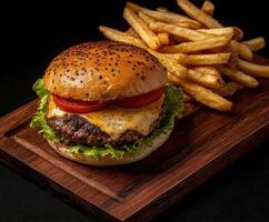 Juicy cheeseburger with fresh vegetables and crispy fries on a wooden plate photo