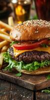 Juicy cheeseburger with fresh toppings and crispy fries on wood photo