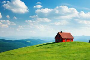 Bright red house on a hilltop surrounded by lush green fields and blue skies photo