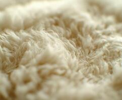 Wool texture close-up showing soft fibers and natural warmth during daylight photo