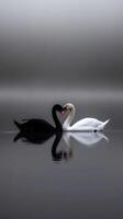 Swans forming a heart shape on a misty lake at dawn photo