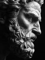 Ancient marble sculpture of a bearded philosopher in profile view photo