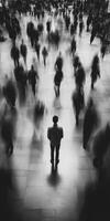 Solitary figure amidst a bustling crowd in a busy urban setting photo