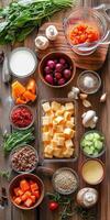 Fresh ingredients arranged for a vibrant vegetable soup preparation photo
