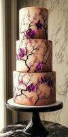 Elegant three-tier cake adorned with orchids and delicate branches photo