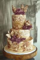 Elegant three-tier cake adorned with butterflies and floral decorations photo