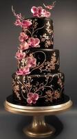 Elegant black wedding cake adorned with orchids and intricate design details photo