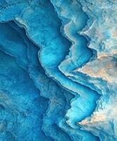 Natural layers of blue sediment showcasing geological formations and textures photo