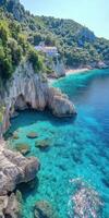 Breathtaking coastal view showcasing clear turquoise waters and rocky cliffs photo
