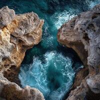 Rock formations and ocean waves create beauty along the coastline photo