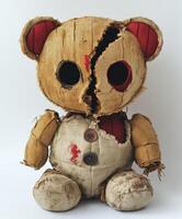 Vintage teddy bear with unique design and weathered appearance photo