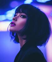 Captivating portrait of a model with a modern hairstyle in vibrant lighting photo