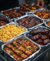 Delicious barbecue spread featuring grilled meats and sides at a gathering photo