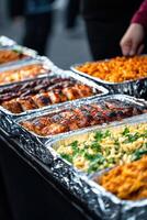 Delicious variety of grilled and baked dishes at a food event photo