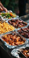 Delicious barbecue spread with various side dishes at outdoor gathering photo