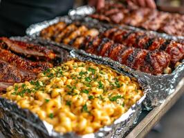 Delicious barbecue spread with ribs and macaroni at outdoor gathering photo