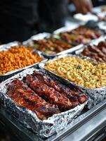 Grilled barbecue ribs with macaroni and cheese at outdoor food festival photo