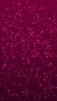 Shiny twinkling stars and bokeh particles on a dark red magenta gradient. This elegant glittering vertical event background is perfect for projects celebrating romance, luxury, or special occasions. video