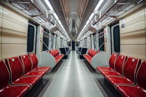 Empty subway car with red seats waiting for passengers photo