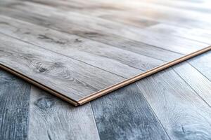 Sample of laminate flooring material presenting its texture and pattern photo