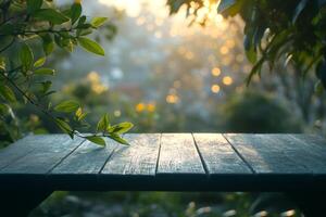 Empty wooden table in a garden during sunset with bokeh effect photo