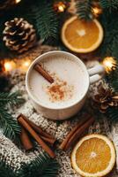 Cozy winter eggnog with cinnamon, orange slices, pine cones and string lights creating festive atmosphere photo