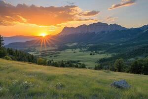Sun setting behind square butte illuminating the valley and grassy field photo
