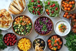Catering food table with colorful fruits, vegetables, bread, and dips displaying healthy meal options photo