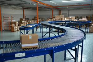 A conveyor belt in a warehouse with boxes and boxes photo