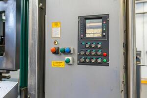 A machine with a control panel and a machine photo