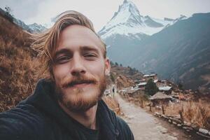 A man with a beard and a beard taking a selfie photo