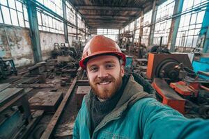 A man in a factory taking a selfie photo