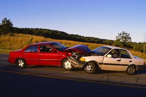 Two cars that have been in an accident photo