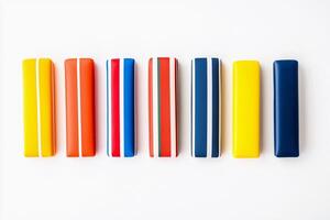 A row of colorful pencils on a white surface photo