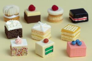 A bunch of different cakes on a table photo