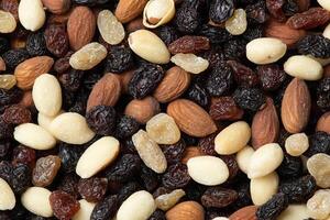 A close up of a pile of mixed nuts and raisins photo