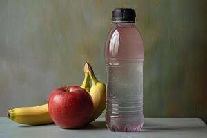 A bottle of water and a banana photo