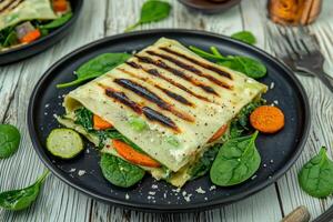 Grilled vegetables and cheese on a plate photo
